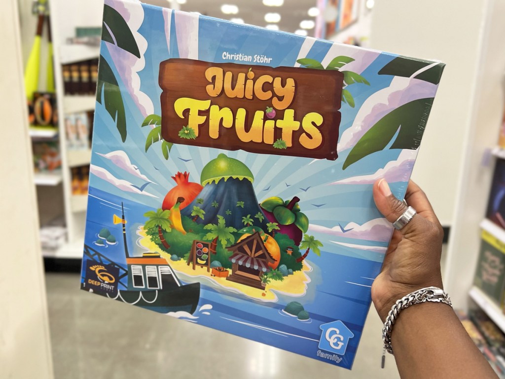 hand holding box to Juicy Fruits Game