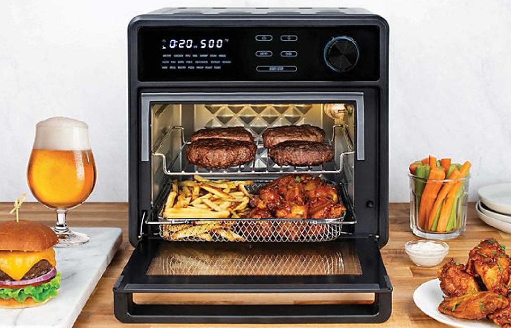 Kalorik MAXX Touch 16 Quart Air Fryer Oven displayed with food around it