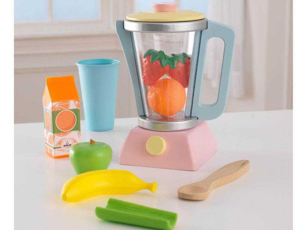 A child's wooden blender with plastic food