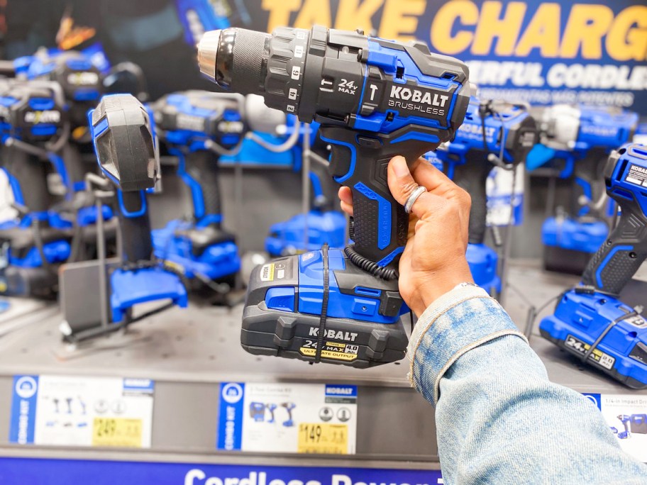 hand holding up blue and black Kobalt Impact Driver