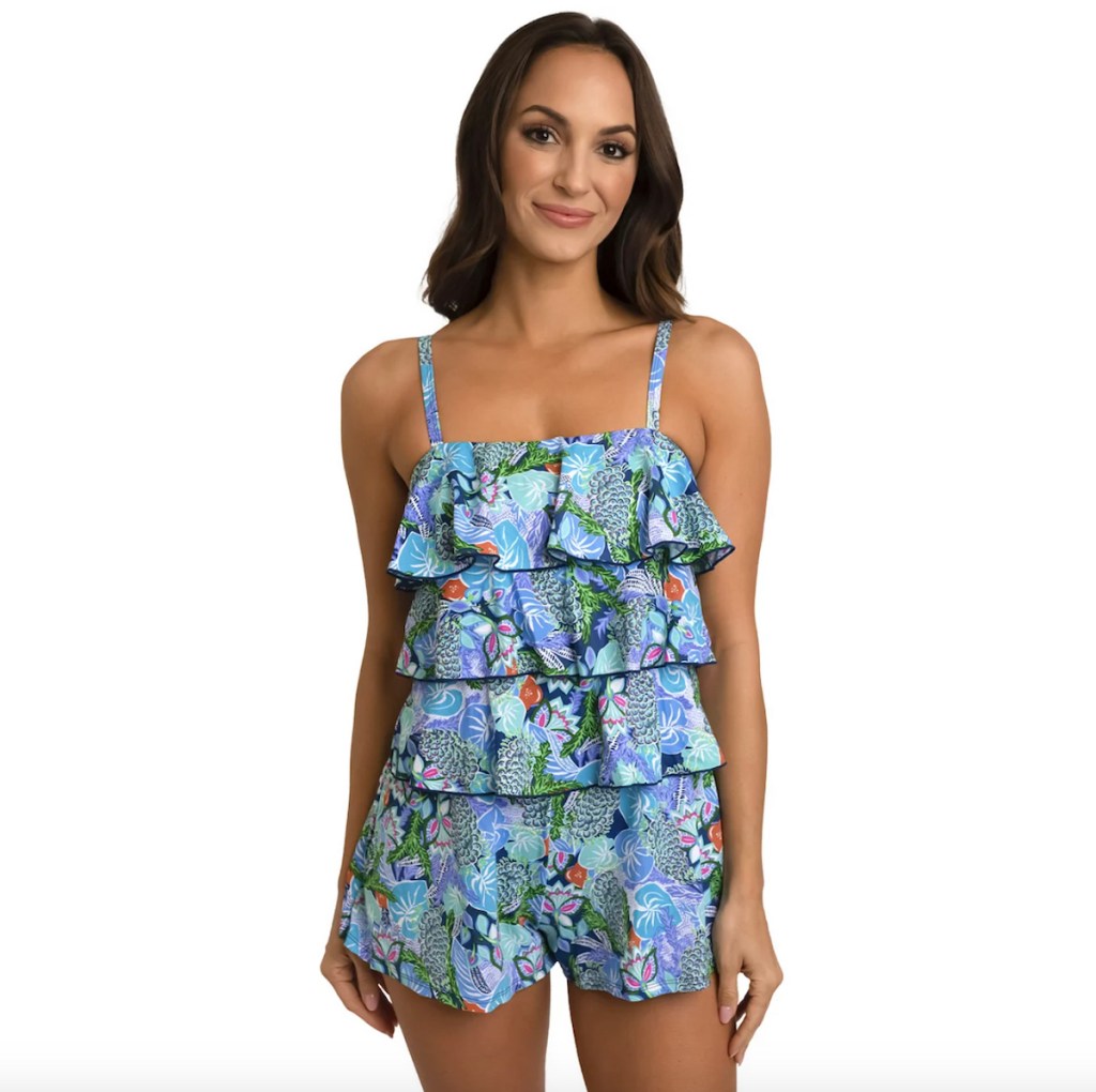 stock photo of woman wearing tropical tiered swim romper