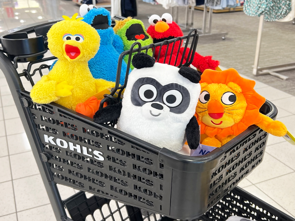 stuffed animals in a black kohl's shopping cart