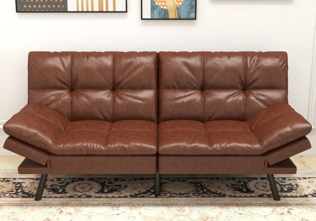 Brown vegan leather couch on a rug