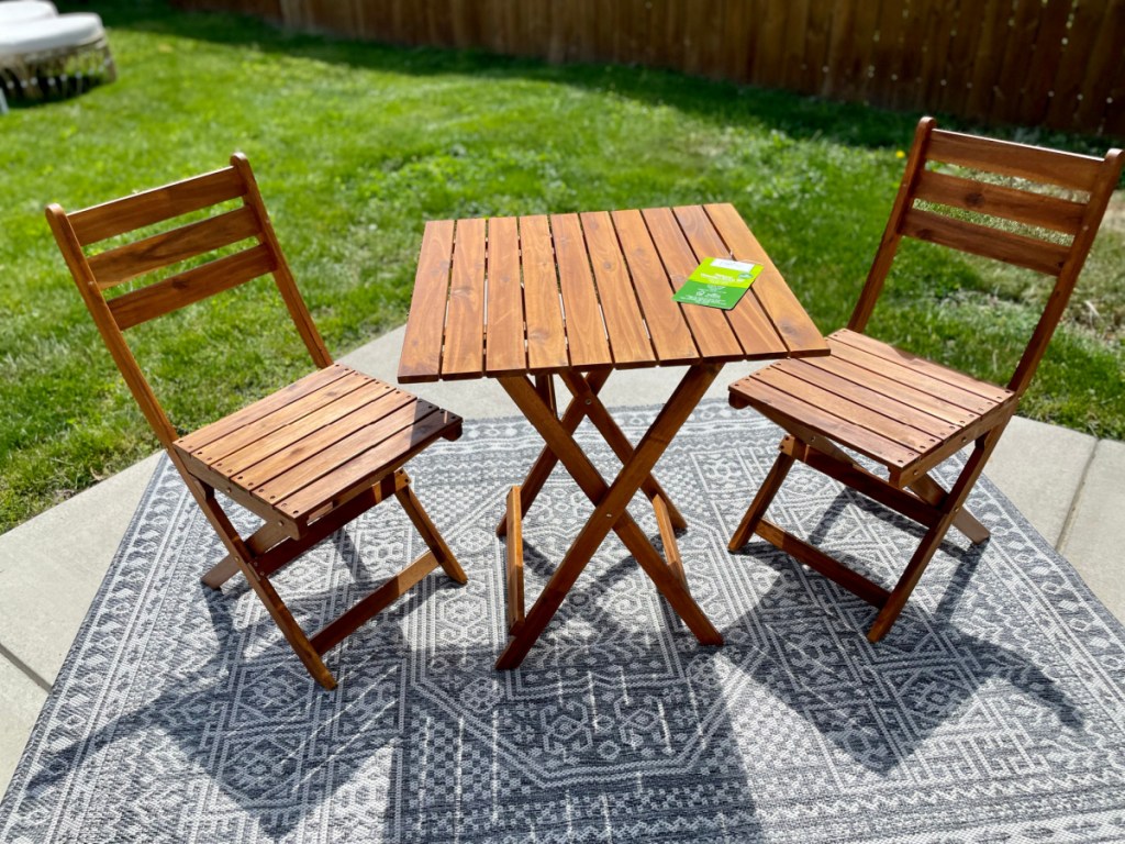 A back patio with a Mainstays Outdoor Patio Bistro Set bought from the Walmart patio furniture section