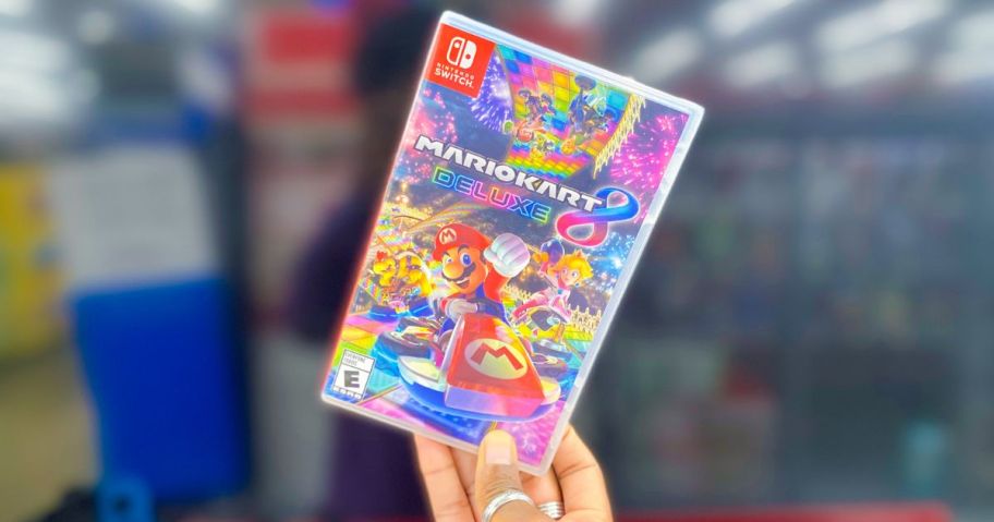  Mario Kart 8 Deluxe Nintendo Switch Game being held by hand in store