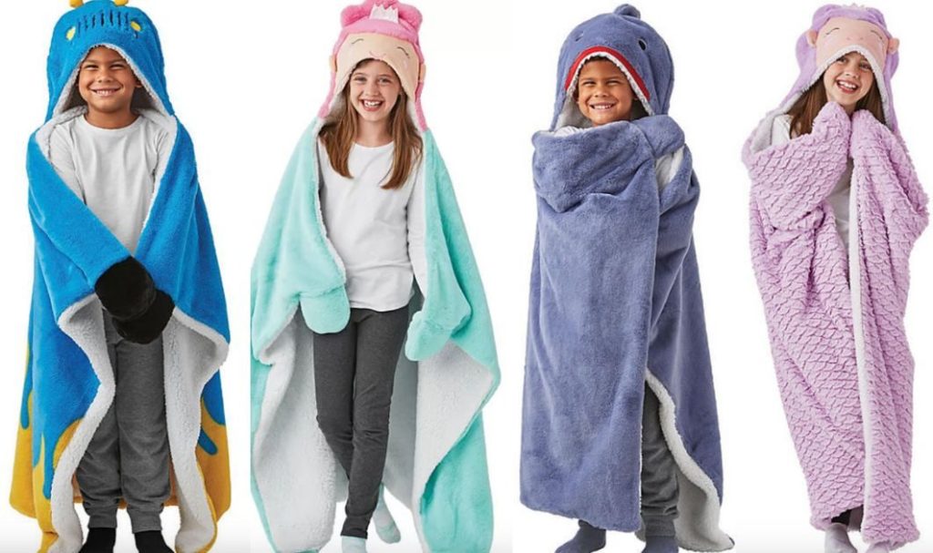4 kids wearing Member's Mark hooded blankets