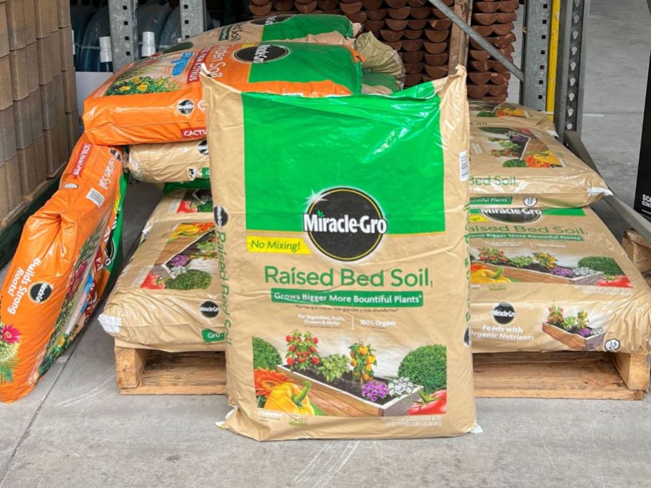 Bags of Miracle Gro Raised Bed Soil in the store