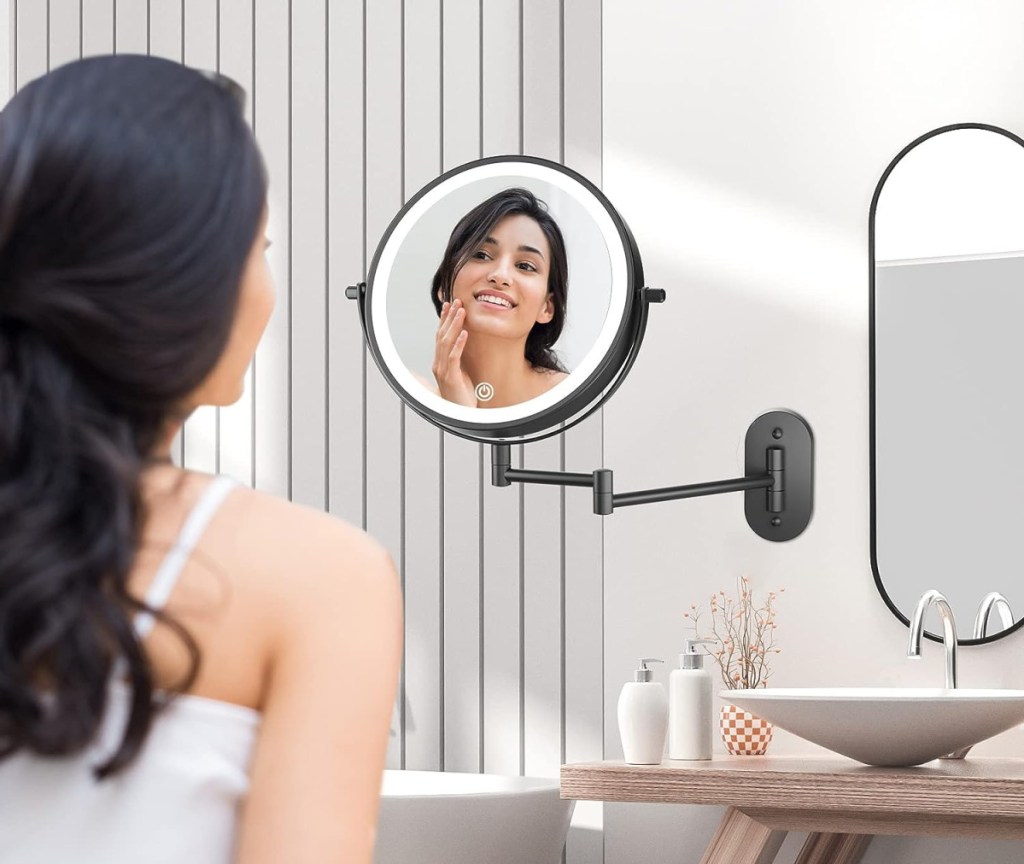 Woman using a mounted vanity from Amazon