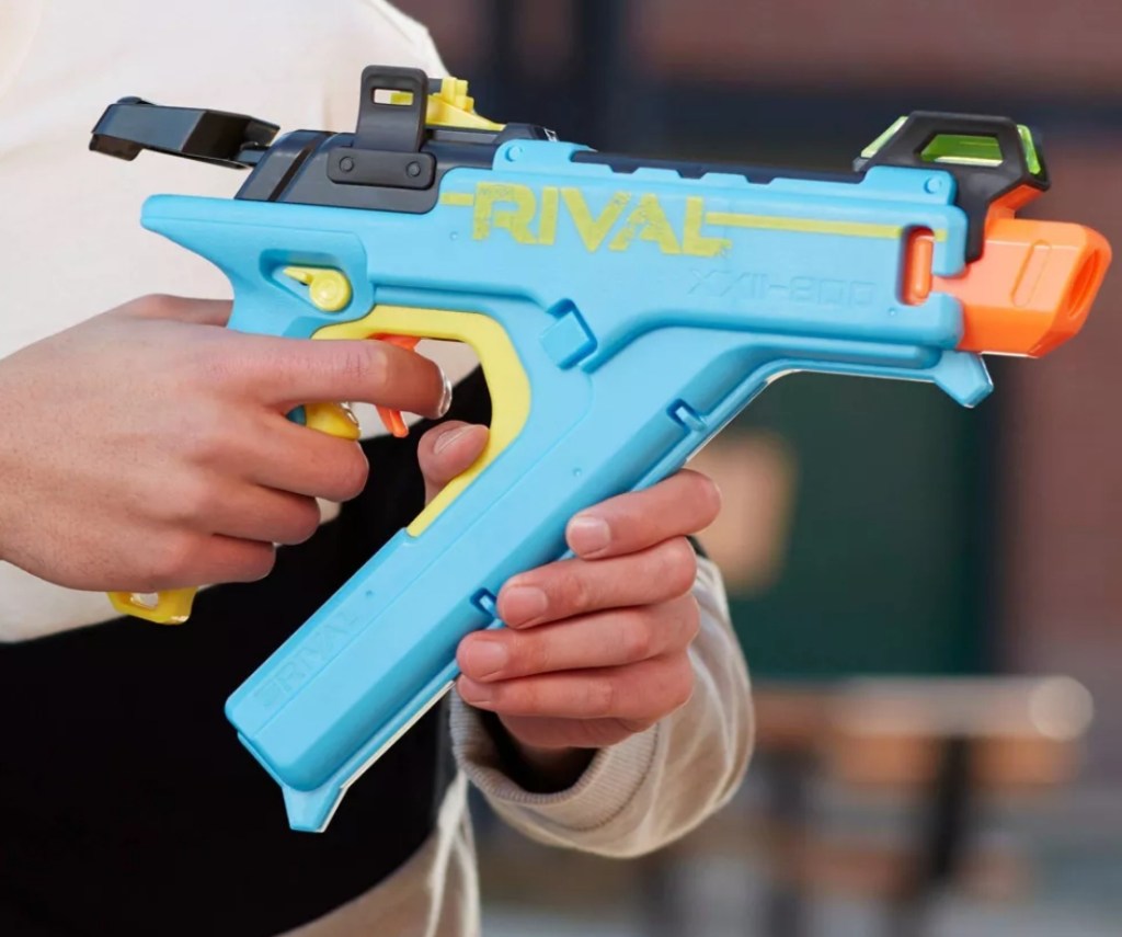Hands holding a NERF blaster