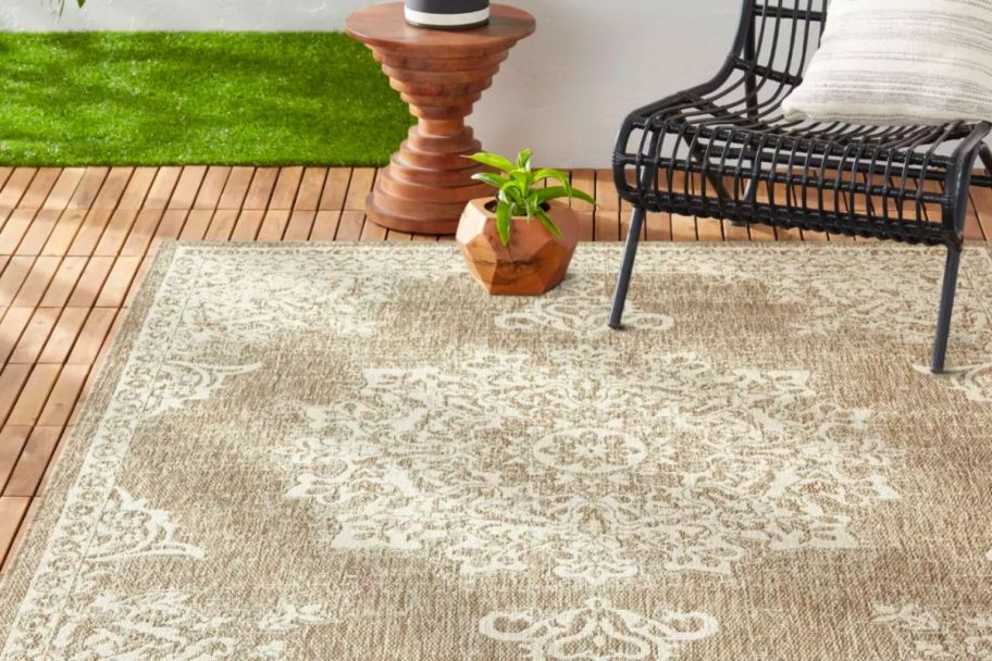 beige outdoor rug on patio
