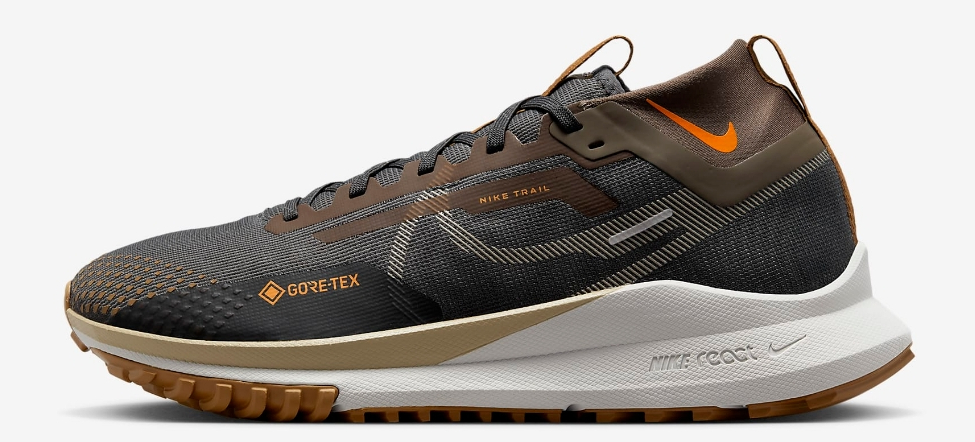 Brown, orange, and white Nike trail running shoe
