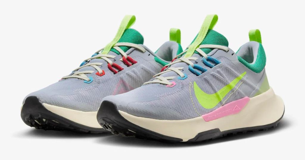 Pair of grey, green, pink, and blue Nike trail running shoes