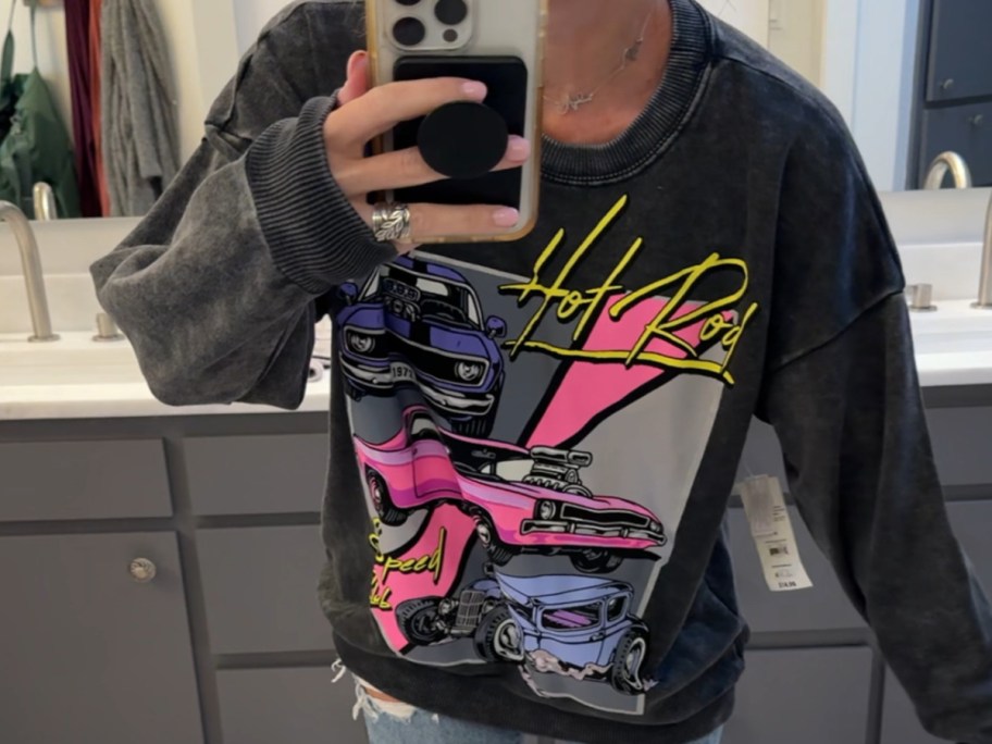 woman wearing a no boundaries Sweatshirt