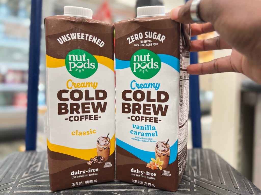 Nutpods Cold Brew Coffee Carton in woman's hand in the aisle at Target