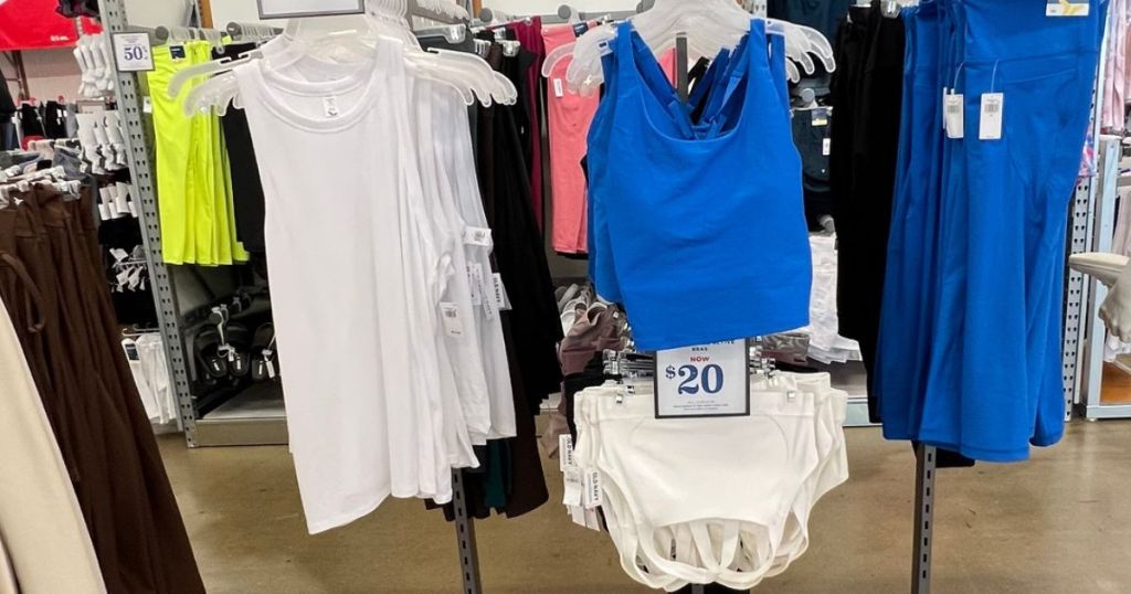Old Navy Active Tanks and Sports Bras hanging on racks in the store