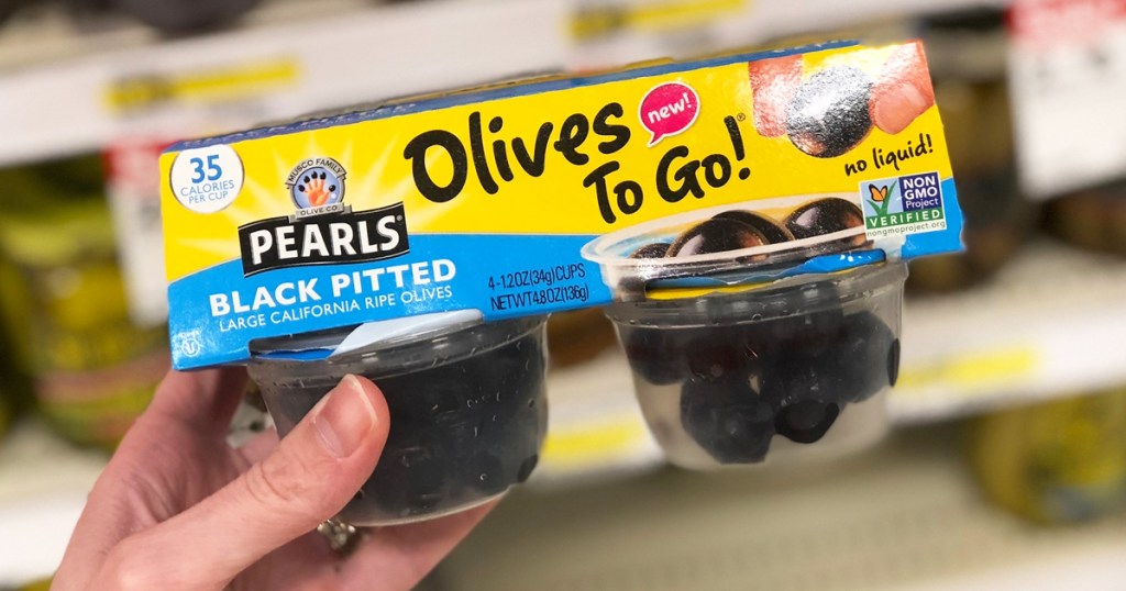 hand holding a pack of Pearls Olives To Go
