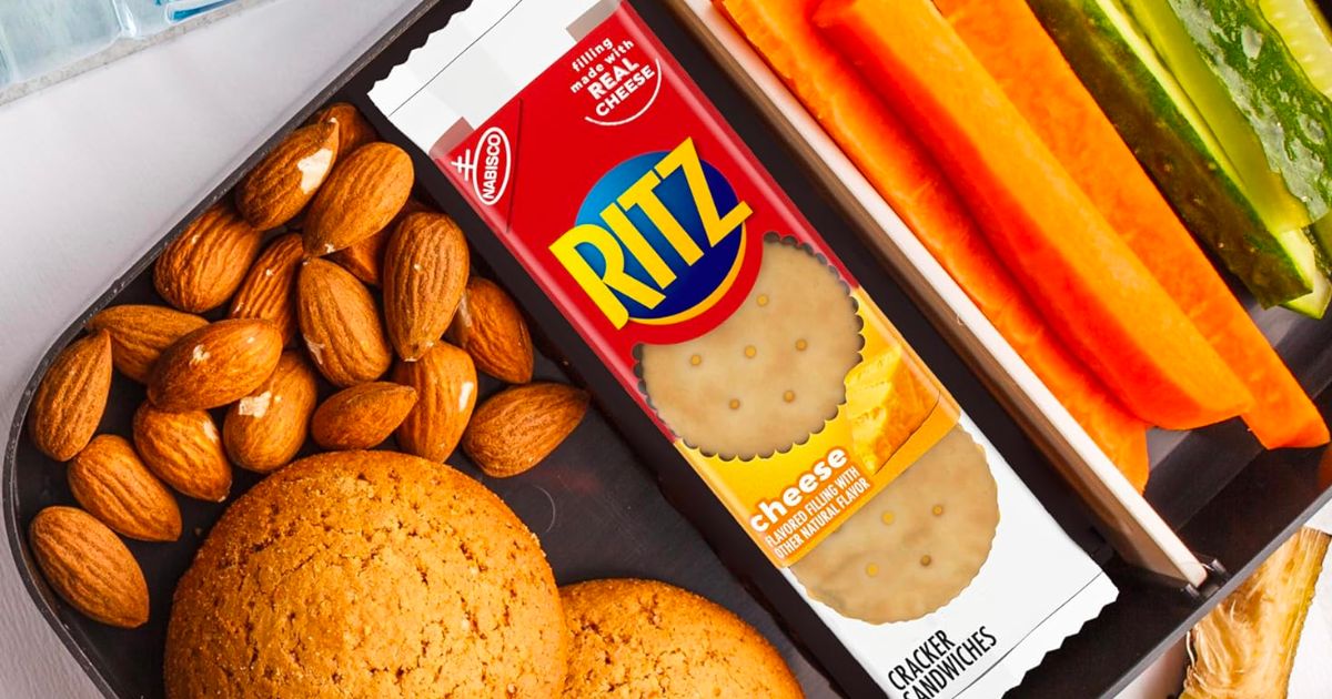 RItz cheese sandwich snack crackers packed in a lunch with almonds. carrot sticks and celery