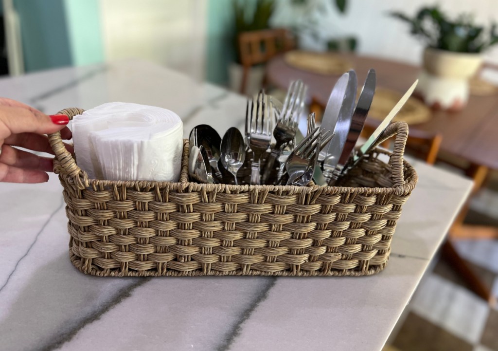 Better homes and gardens rattan utensil caddy from Walmart set up on an outdoor table for a summer party