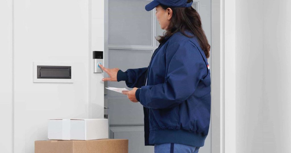 Mail woman ringing a Ring Video doorbell