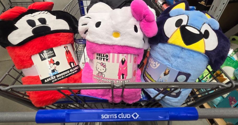 Minnie Mouse, Hello Kitty and Bluey Wearable Throw Blankets in a Sam's Club shopping cart. 