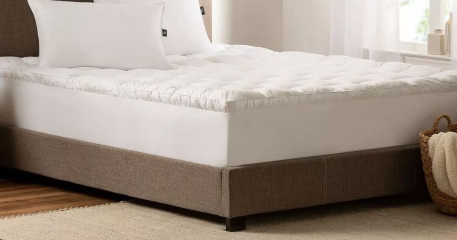 Serta Down Antimicrobial Illusion Pillowtop Mattress Topper on bed in bedroom