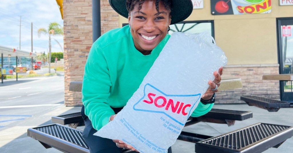 woman holding large bag of sonic ice