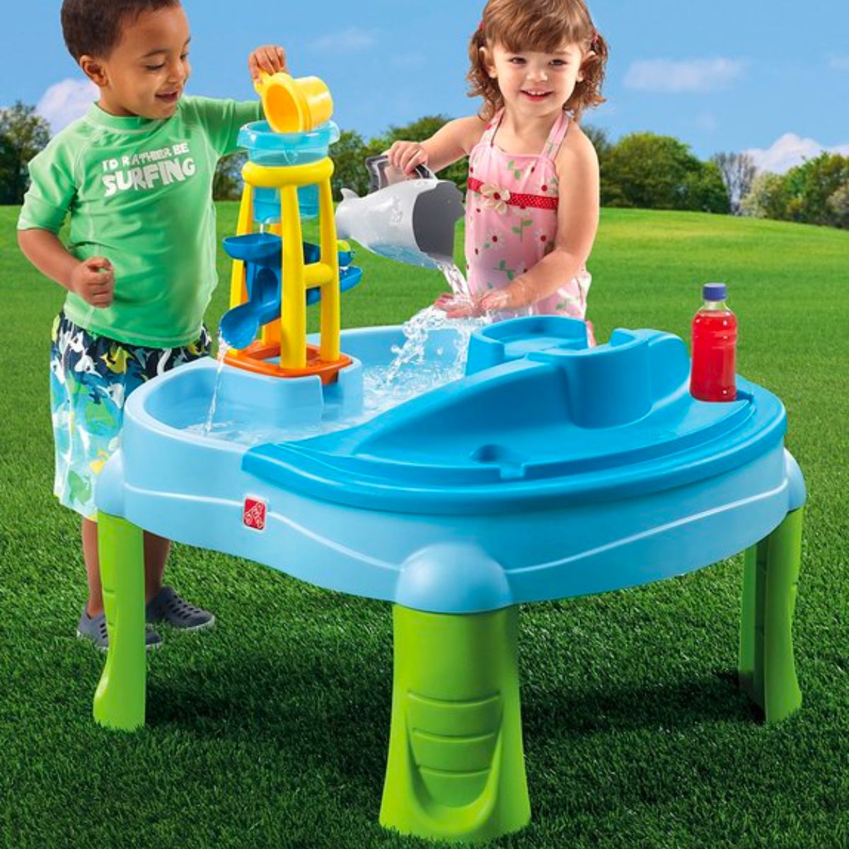 2 toddlers playing with a Splash and Scoop Bay Table