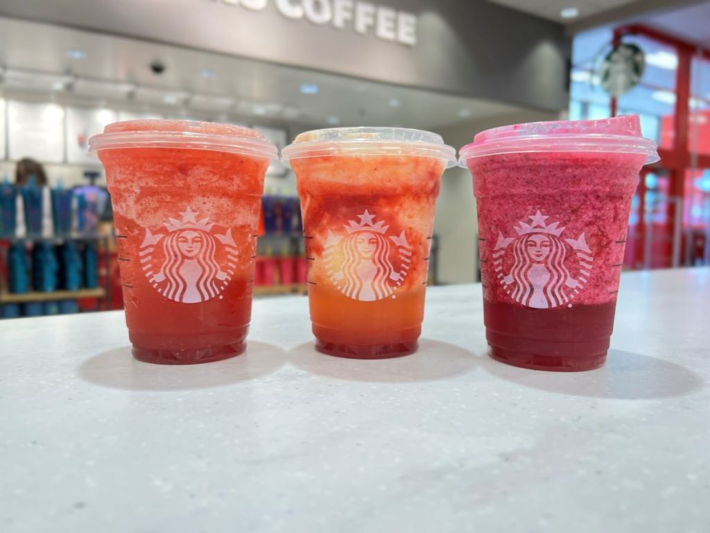 Three Starbucks Frozen Lemonade refreshers on a counter