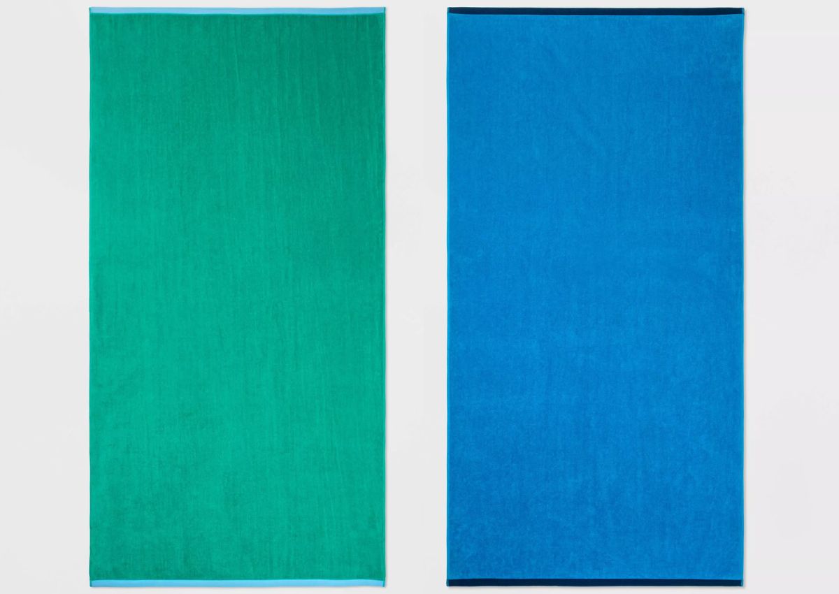 two reversible beach towels in green and blue