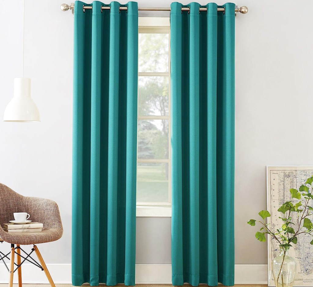 teal curtain panels in front of window