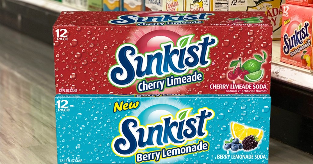 two boxes of sunkist sodas on floor at store