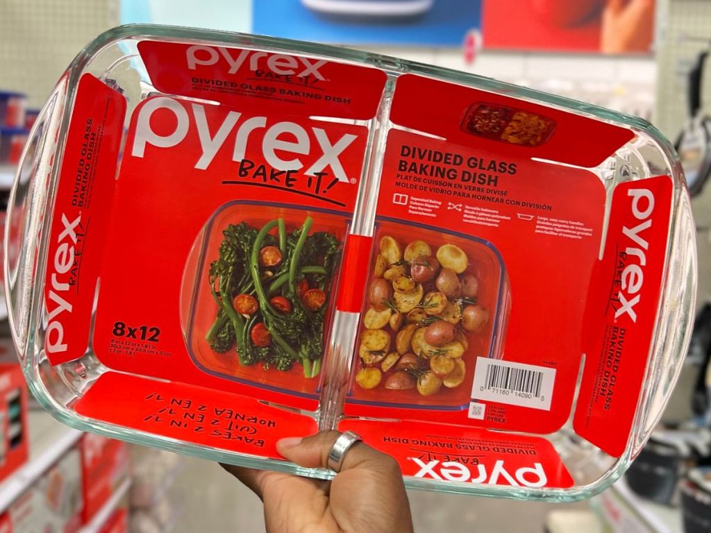 Hand holding up a Pyrex divided baking dish