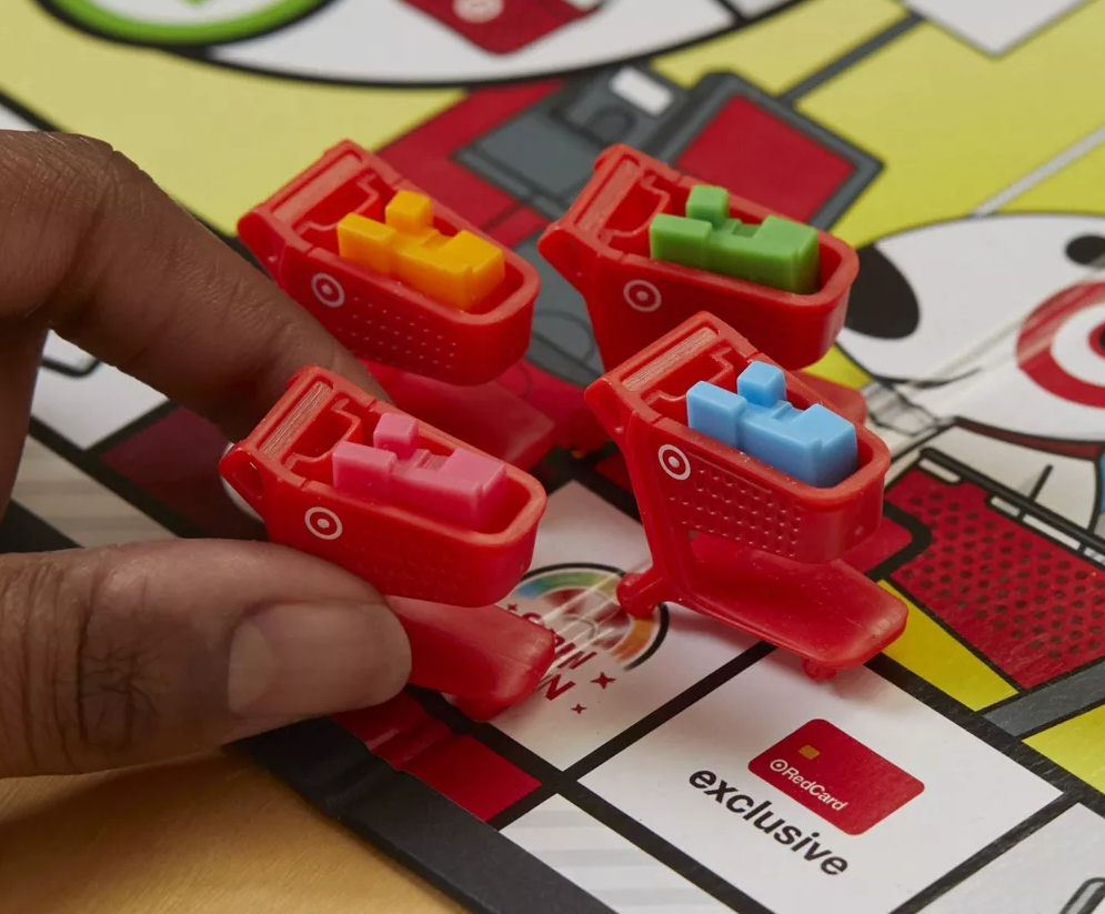 Hand holding a Target Game of Life Cart