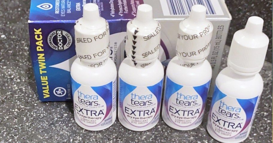 four small bottles of TheraTears Extra Dry Eye Lubricating Drops