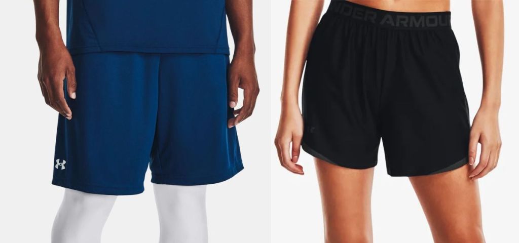 A man wearing navy Under Armour Shorts and a woman wearing black Under Armour shorts