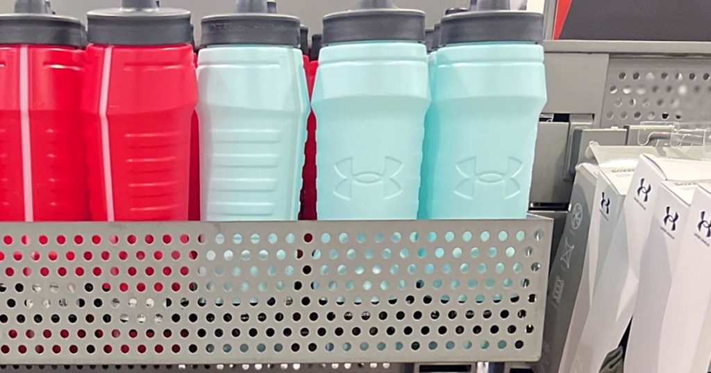 red and blue water bottles on display in store