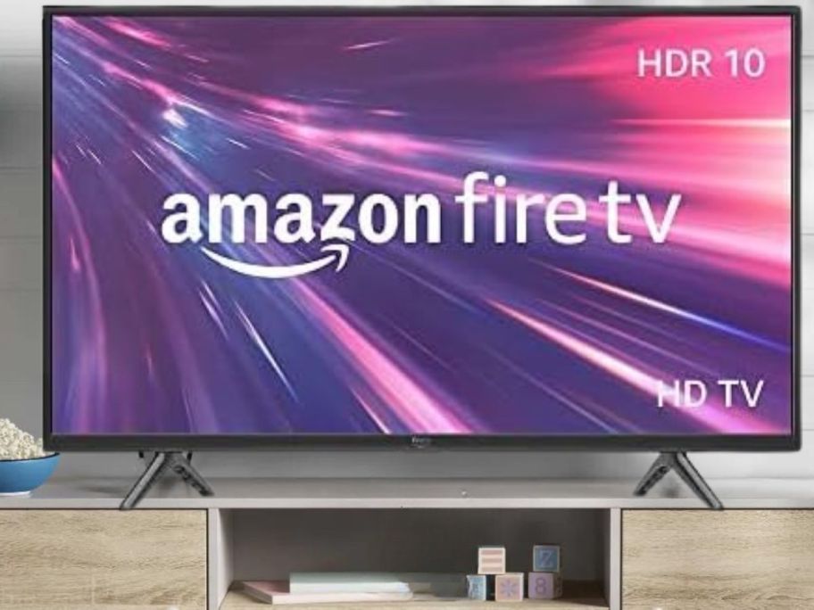 Amazon Fire TV 32" 2-Series HD Smart TV w/ Fire TV Alexa Voice Remote on tv stand
