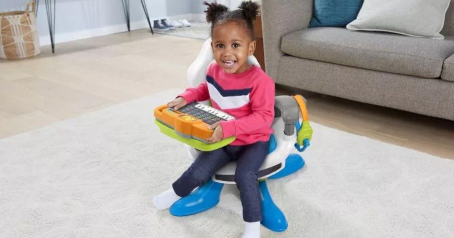 little girl sitting in VTech Level Up Toy Gaming Chair