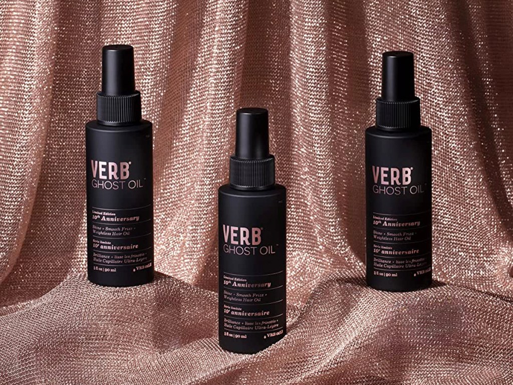 three bottles of Verb Ghost Oil with pink sparkly fabric backdrop