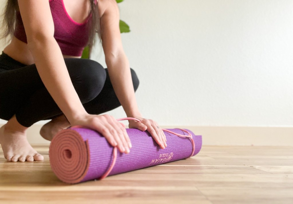 Woman with yoga mat