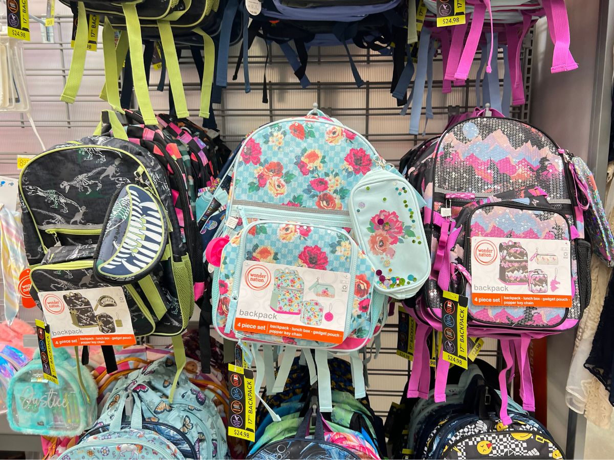 many kids backpacks hanging in store