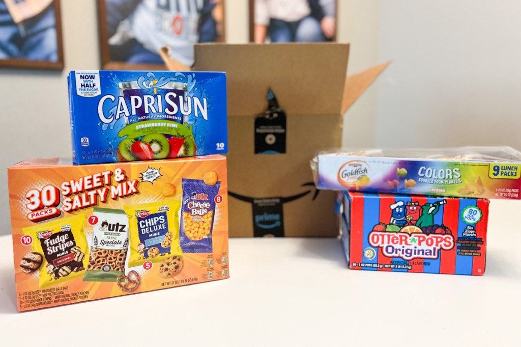 capri sun, goldfish, keebler snacks, and otter pops with amazon box
