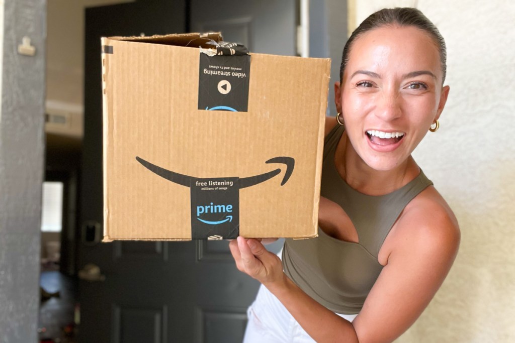 woman holding amazon prime delivery box