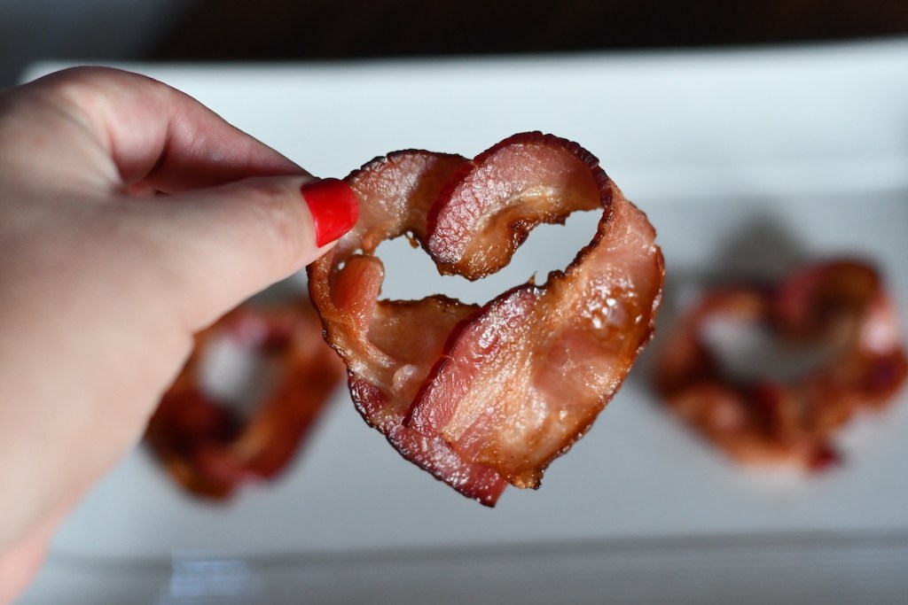 hand holding heart shaped bacon - fathers day gift ideas
