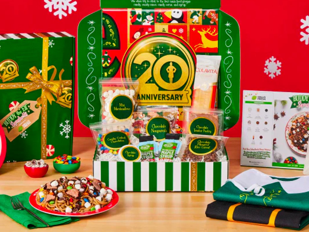 buddy the elf meal kit in box with aprons and plate of spaghetti