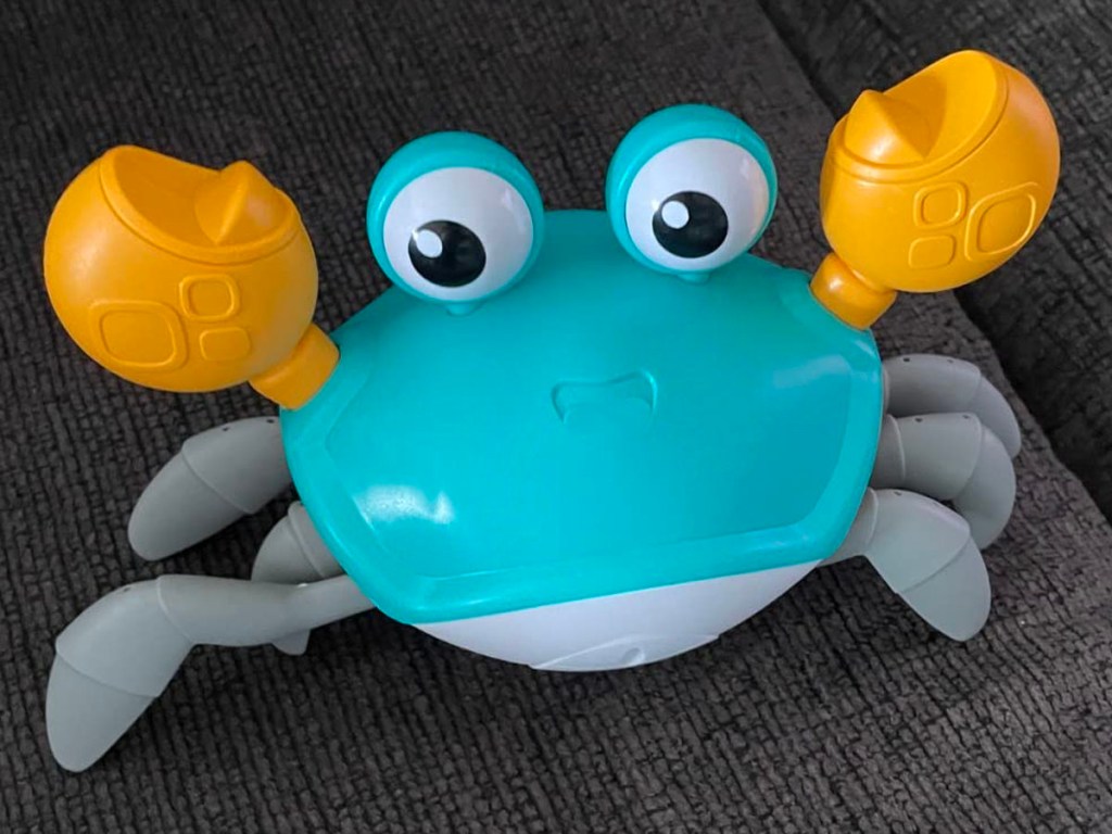 teal and yellow crab baby toy