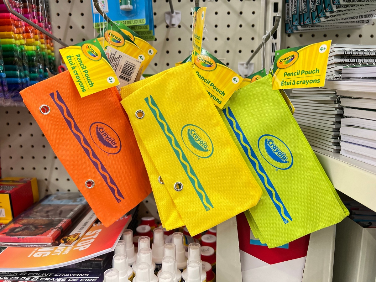Crayola pencil pouches hanging on pegs at Dollar Tree