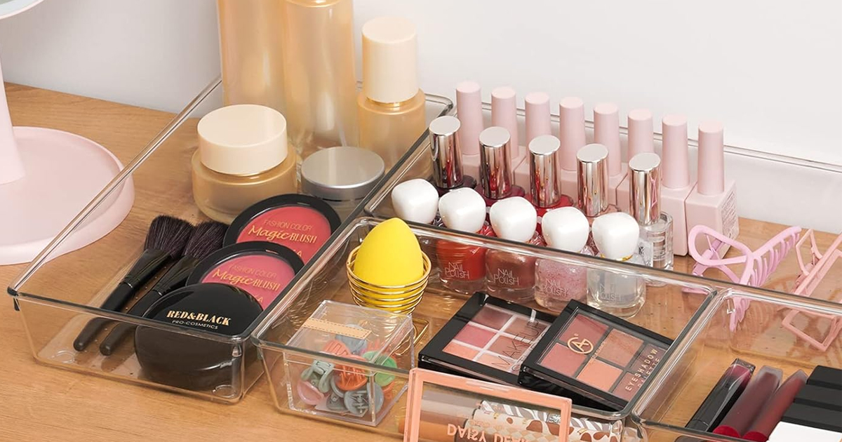 plastic organizers with makeup in them on table