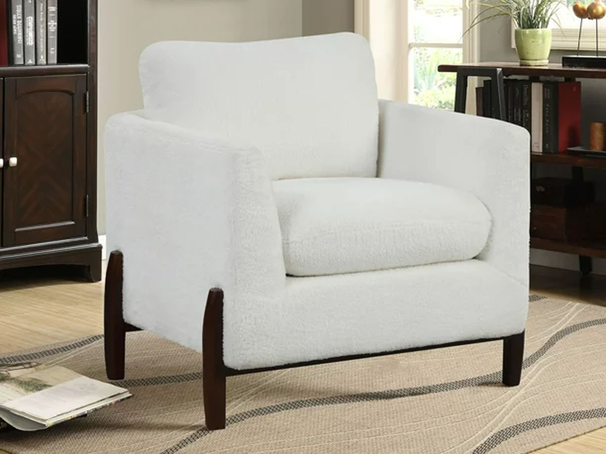 white accent chair with black legs