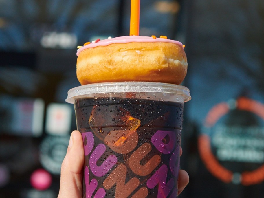 doughnut on top of iced drink from Dunkin
